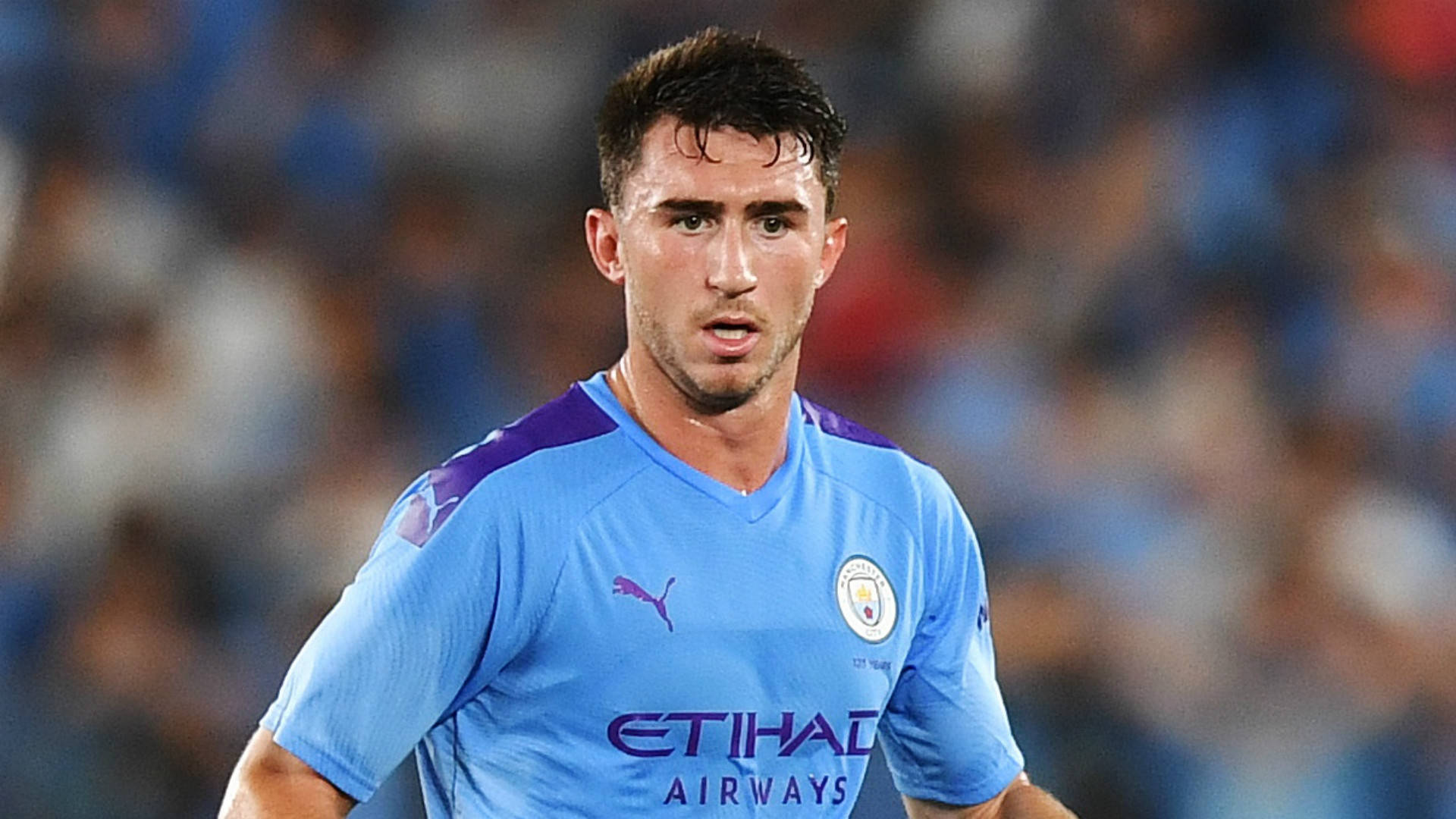 Aymeric Laporte Sporting A Blue Jersey Background