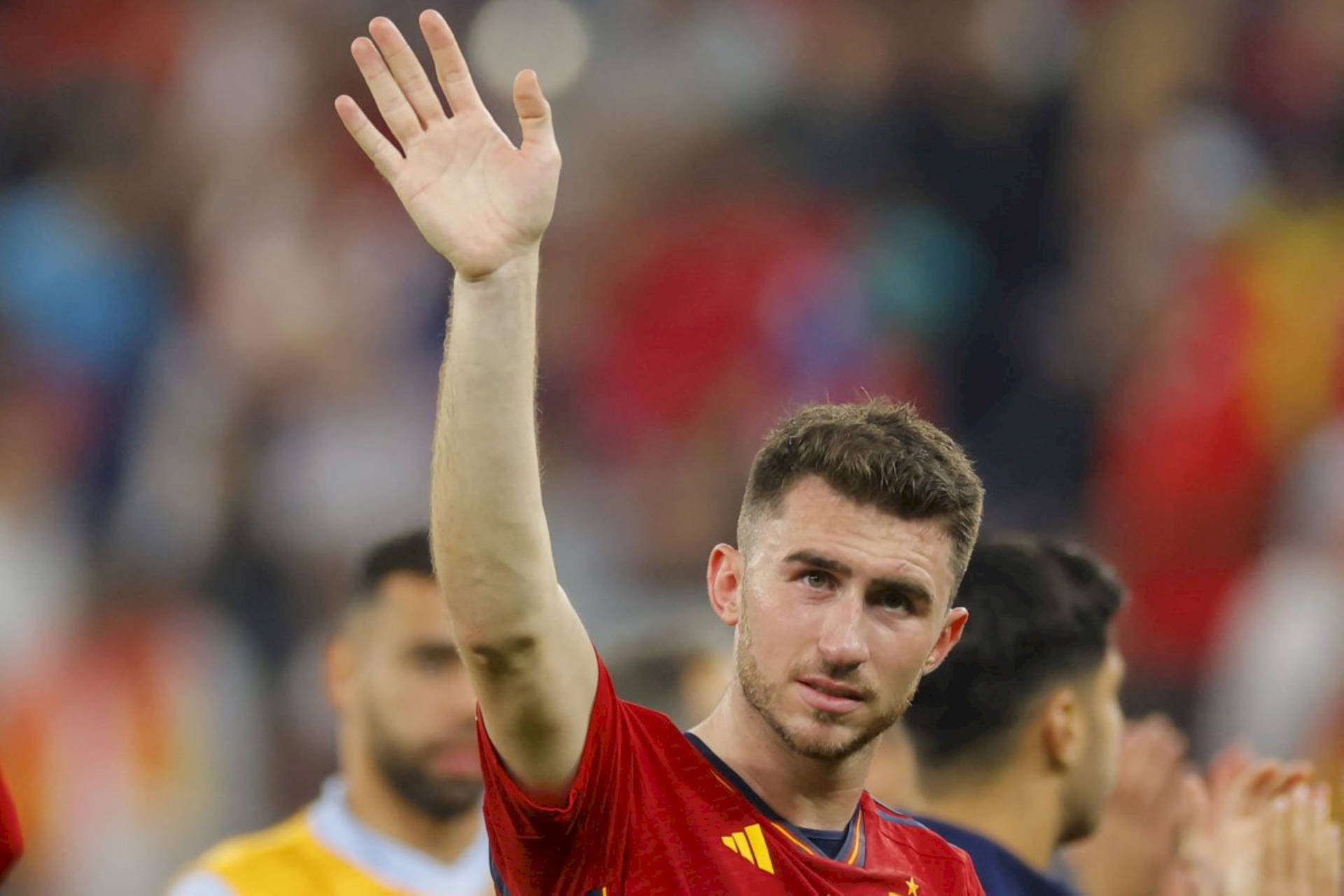 Aymeric Laporte Waving To Fans Background