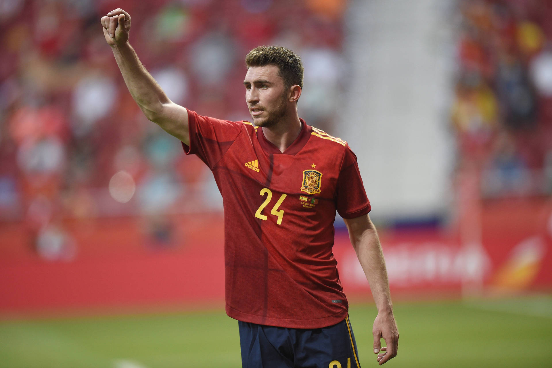 Aymeric Laporte Wearing Red Football Shirt Background