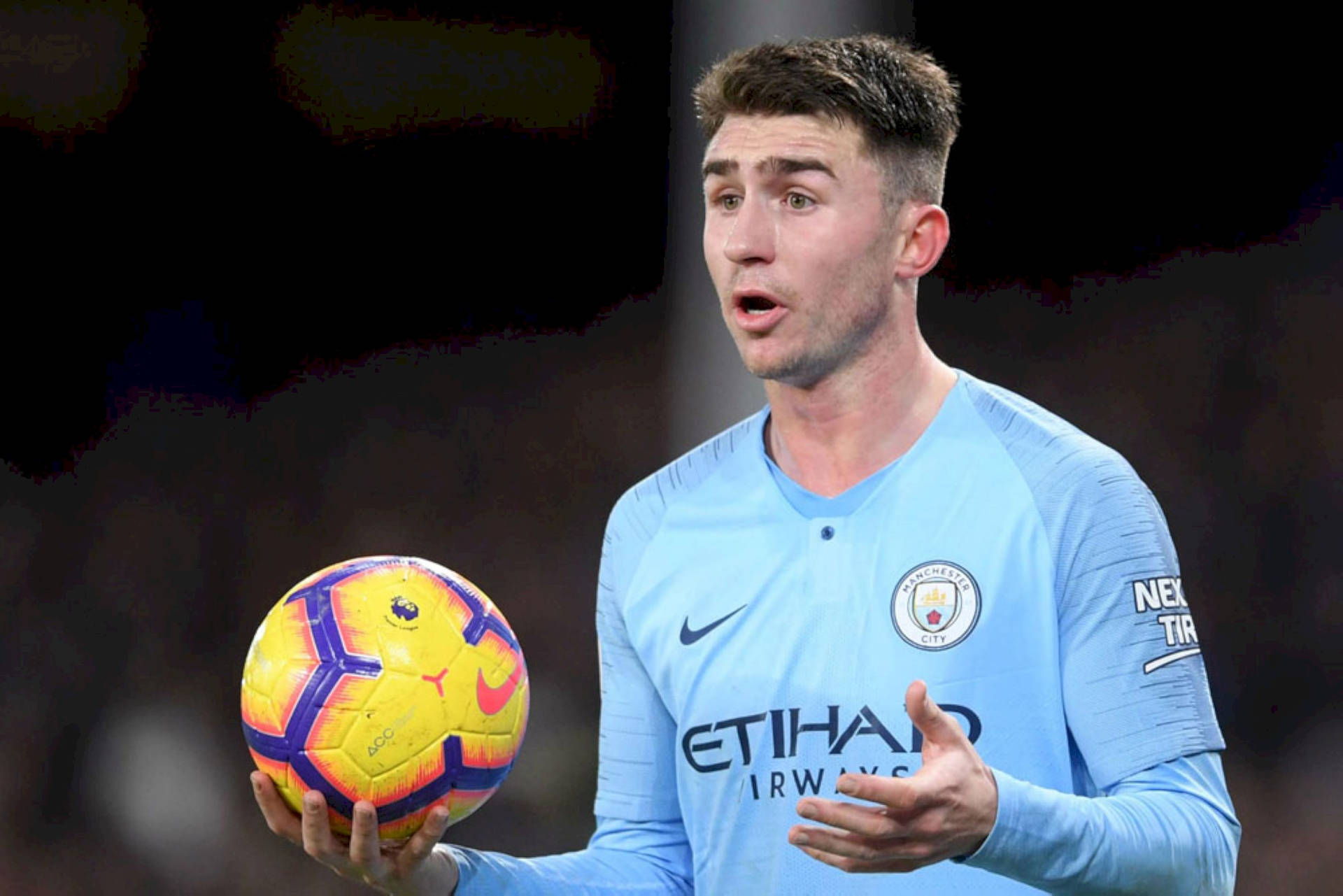 Aymeric Laporte With Football In Hand Background