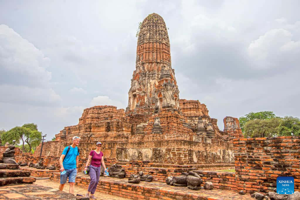 Ayutthaya Historical Park Touristsand Ancient Stupa Background