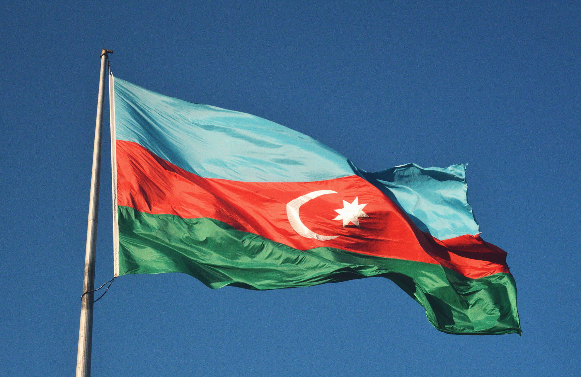 Azerbaijan Flag In Pole Background