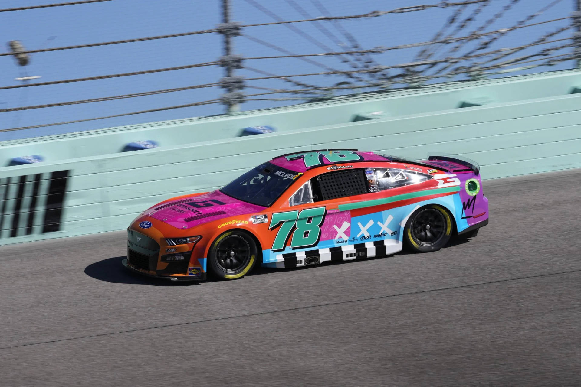 B.j. Mcleod Driving Vibrant Zombie-designed Racing Car Background