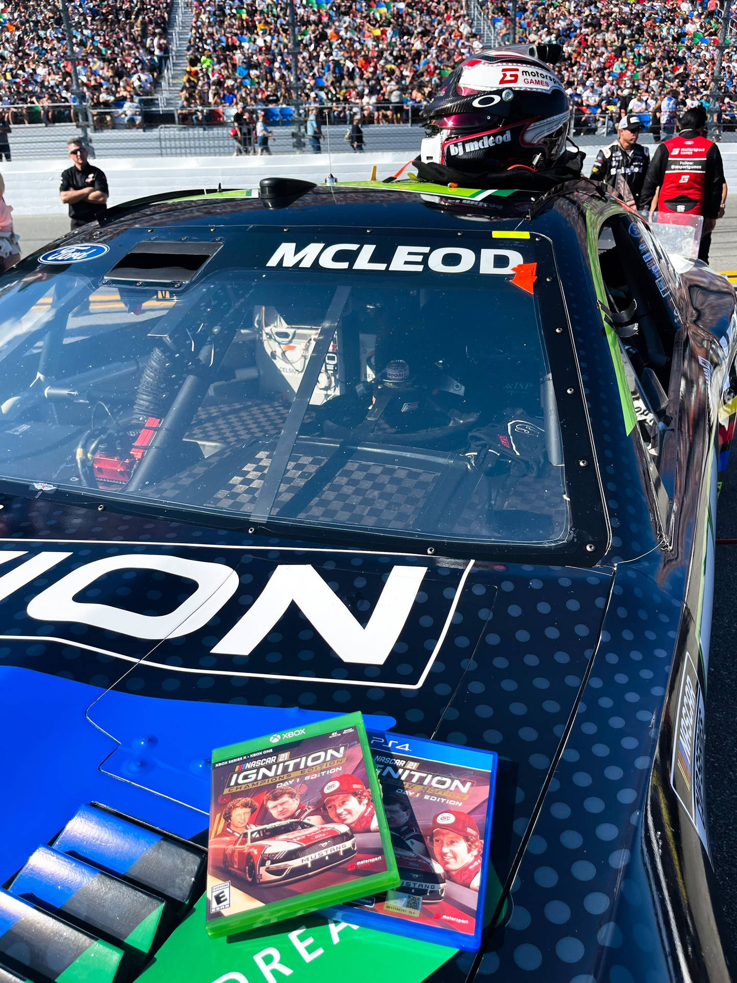 B.j. Mcleod Helmet On Race Car Background