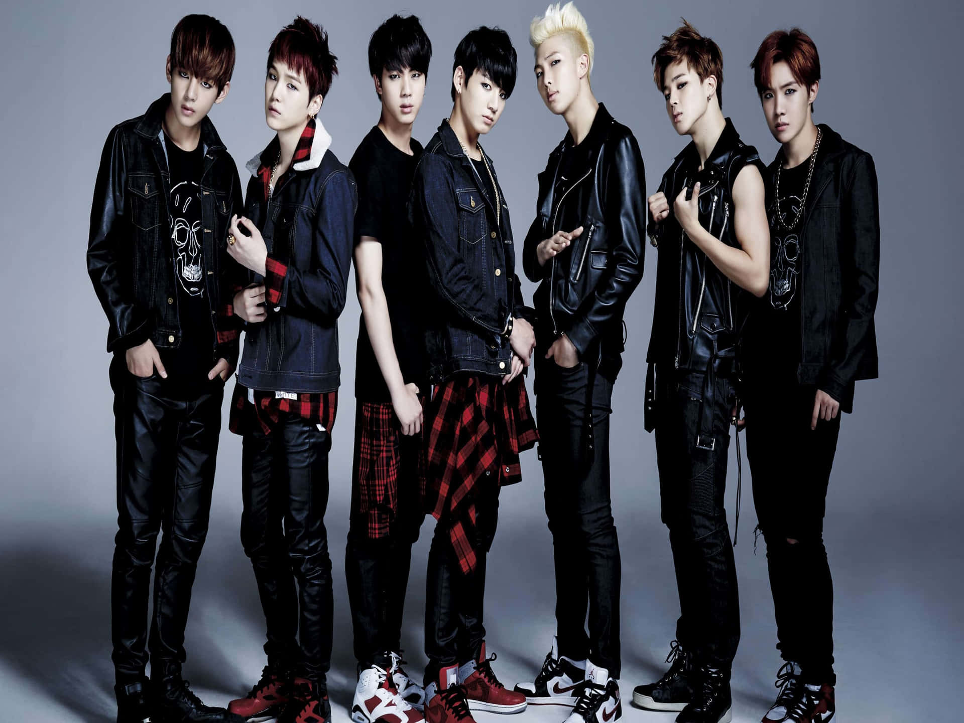 B T S_ Group_ Photo_in_ Leather_and_ Denim Background