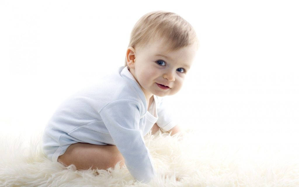 Baby Boy In White Onesie