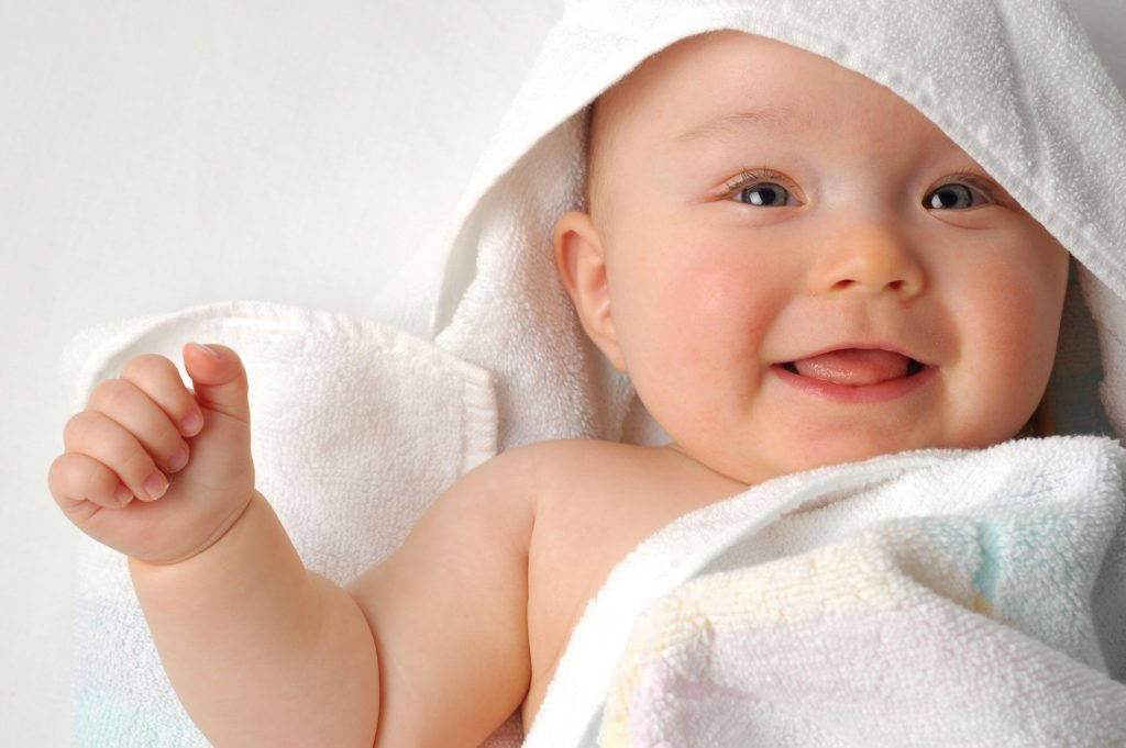 Baby Boy In White Towel Background