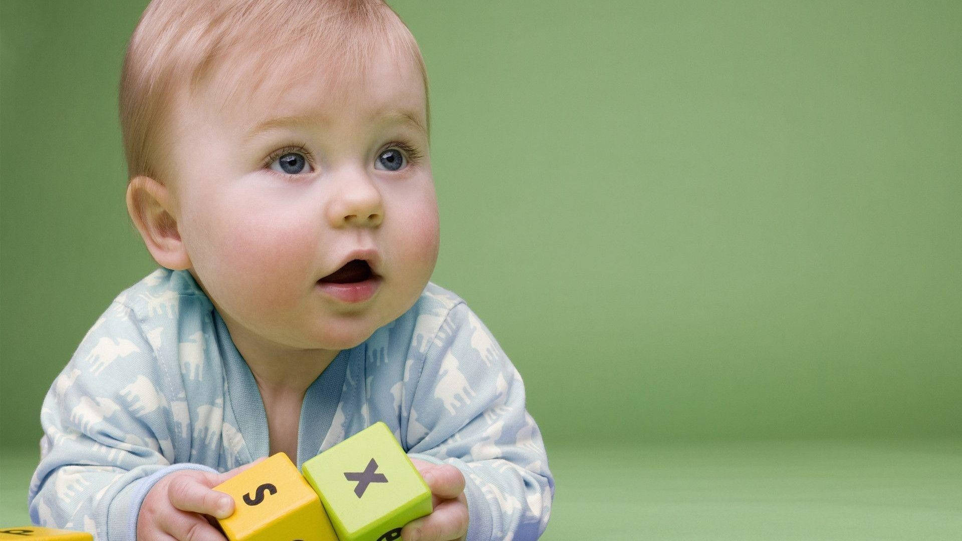 Baby Boy Playing With Colourful Blocks