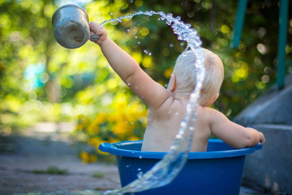 Baby Boy Splashing Water Background