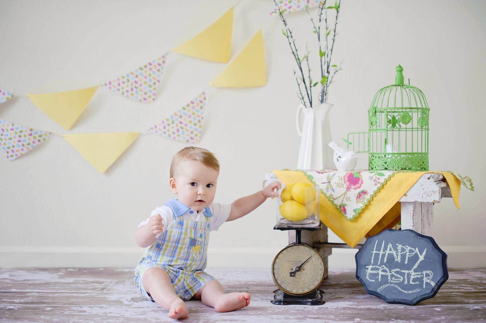 Baby Boy With Glass Of Lemons Background