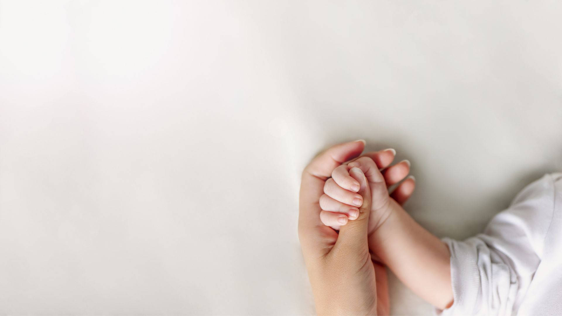 Baby Hand Lying With Mother's Hand Background