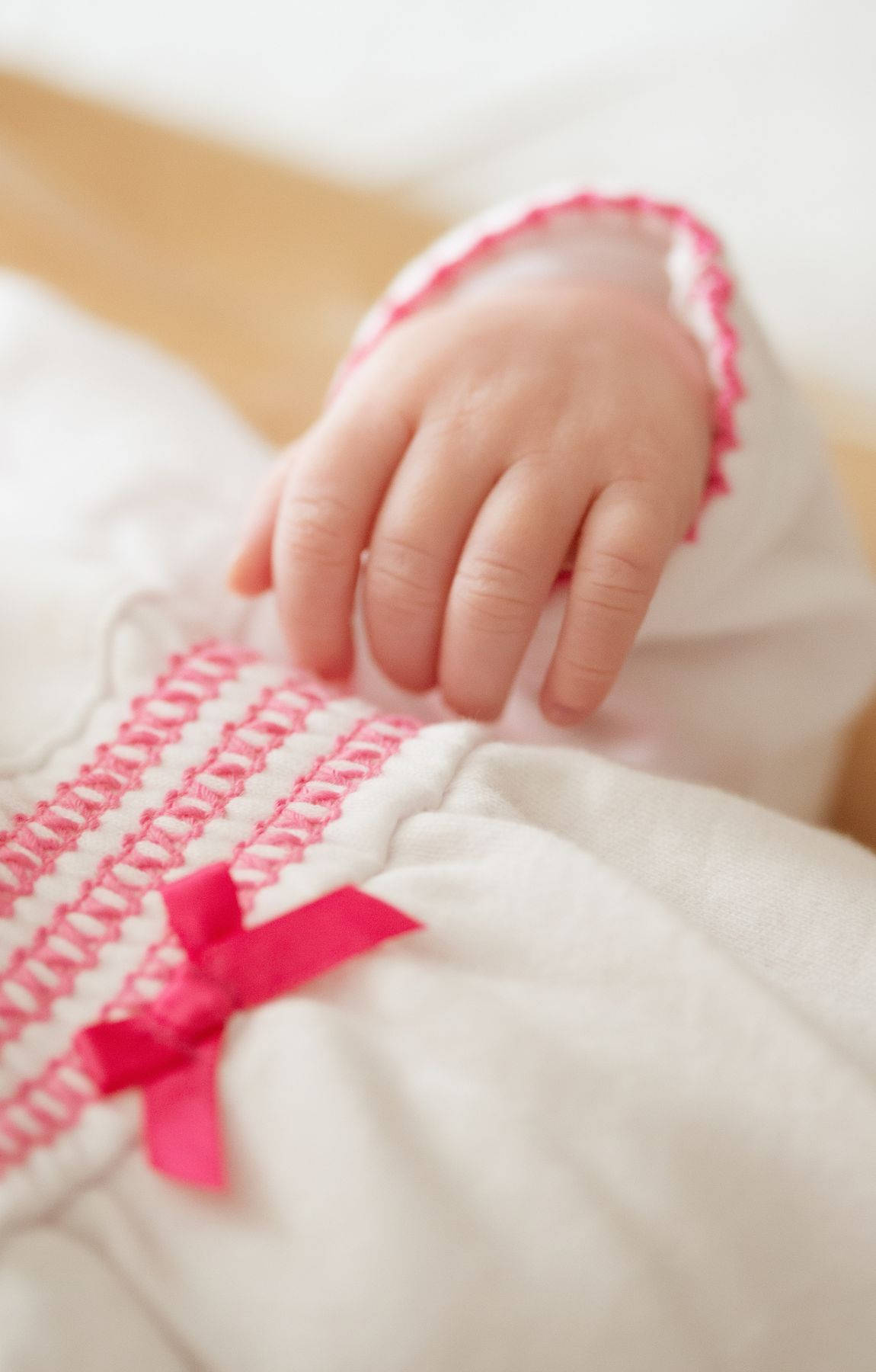 Baby Hand White And Pink Dress Background