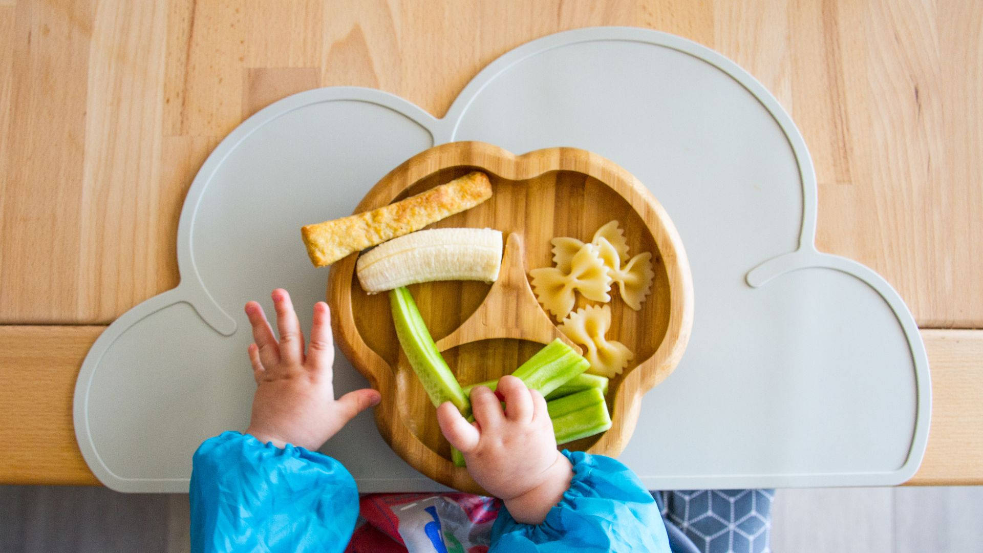 Baby Hands With Plate Of Food Background