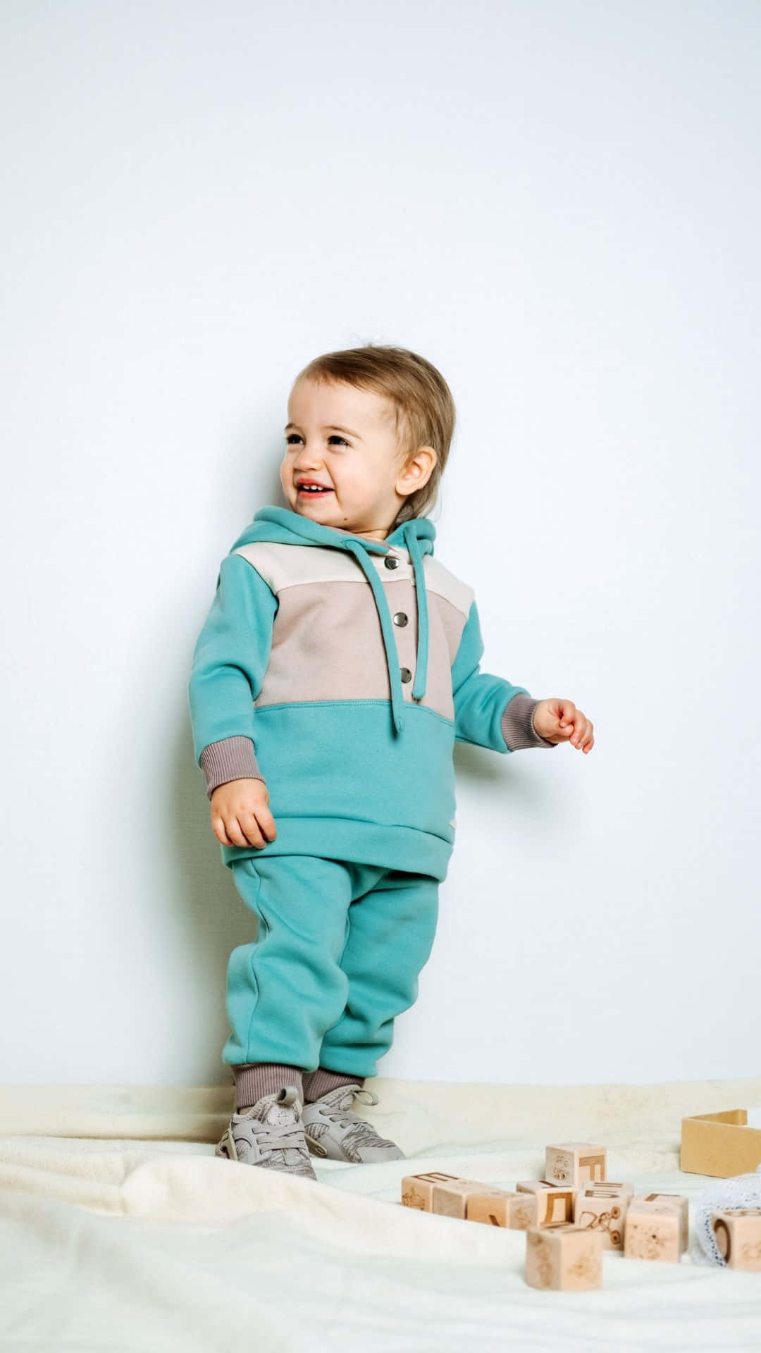 Baby Stylish Boy Wearing Blue Hoodie Background