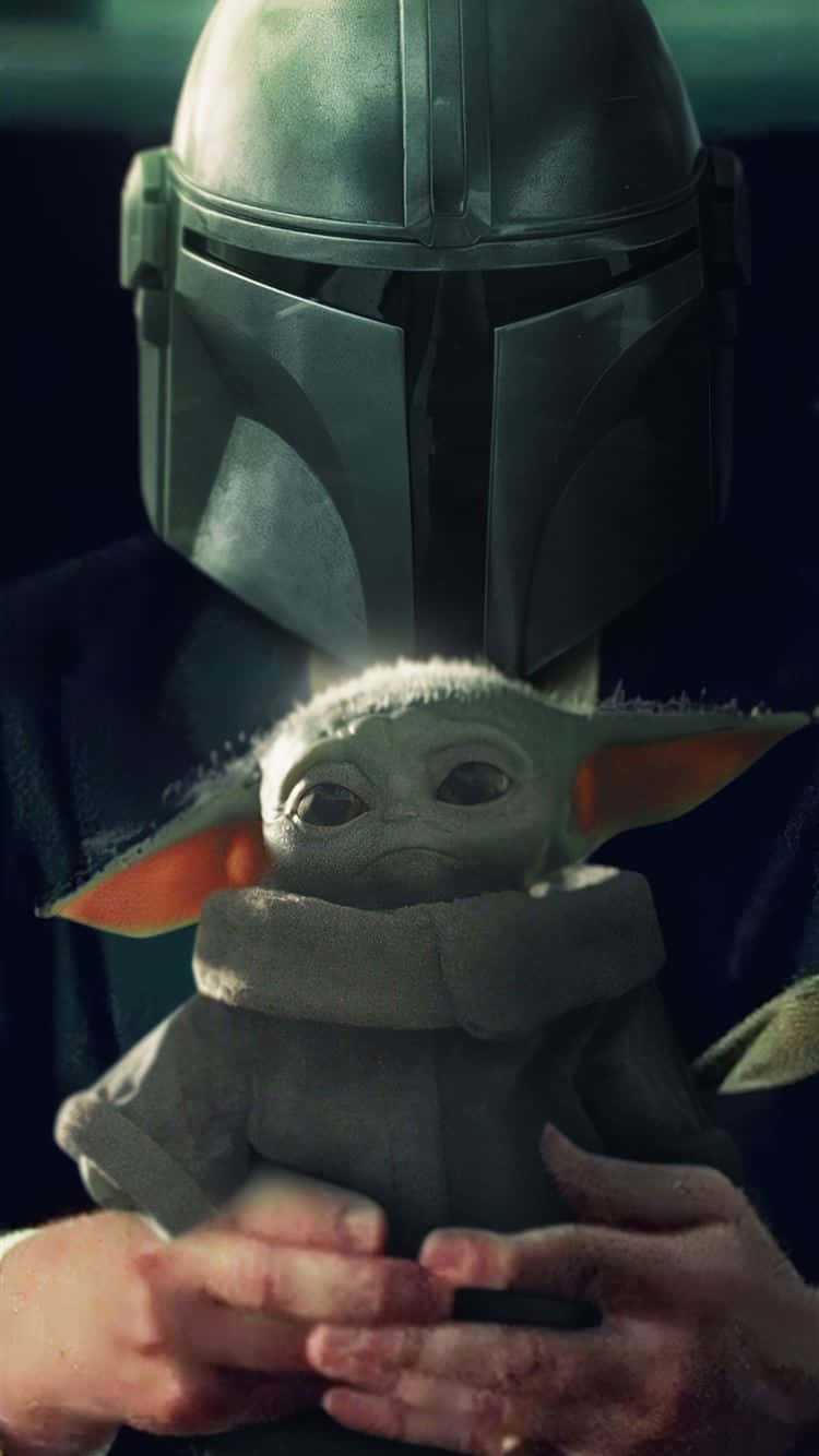 Baby Yoda Being Held Iphone Background