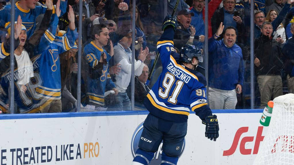 Back View Of Vladimir Tarasenko While Fans Cheer Through The Glass Panels