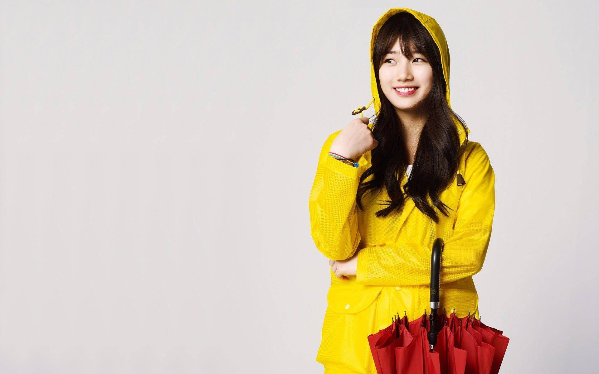 Bae Suzy Showcasing A Vibrant Yellow Raincoat