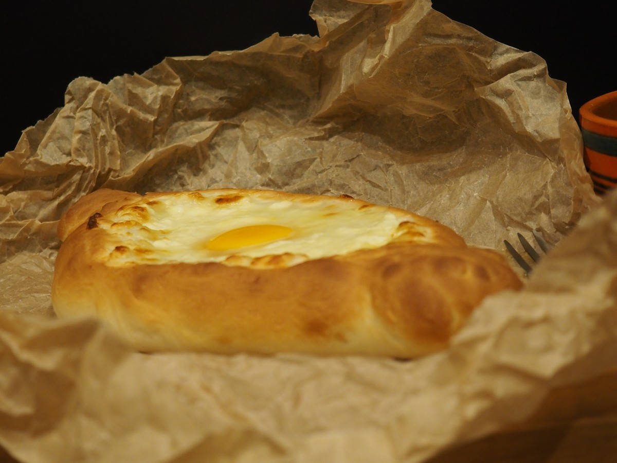 Baked Khachapuri On Brown Wrapping Paper Background