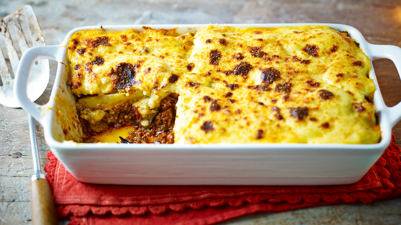 Baked Moussaka On A White Ceramic Tray Background