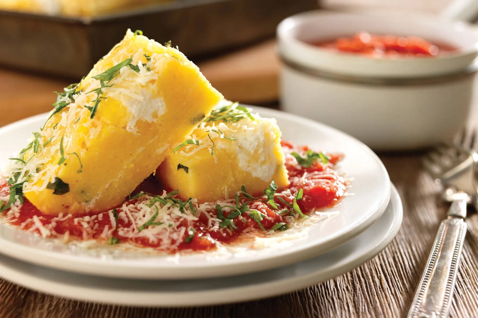 Baked Polenta Cakes With Tomato Sauce And Ricotta Background