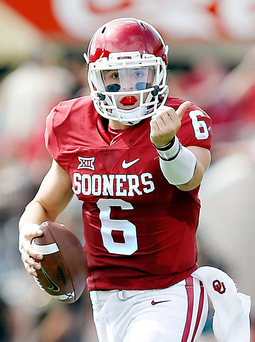 Baker Mayfield Takes The Snap In A Cleveland Browns Game Background