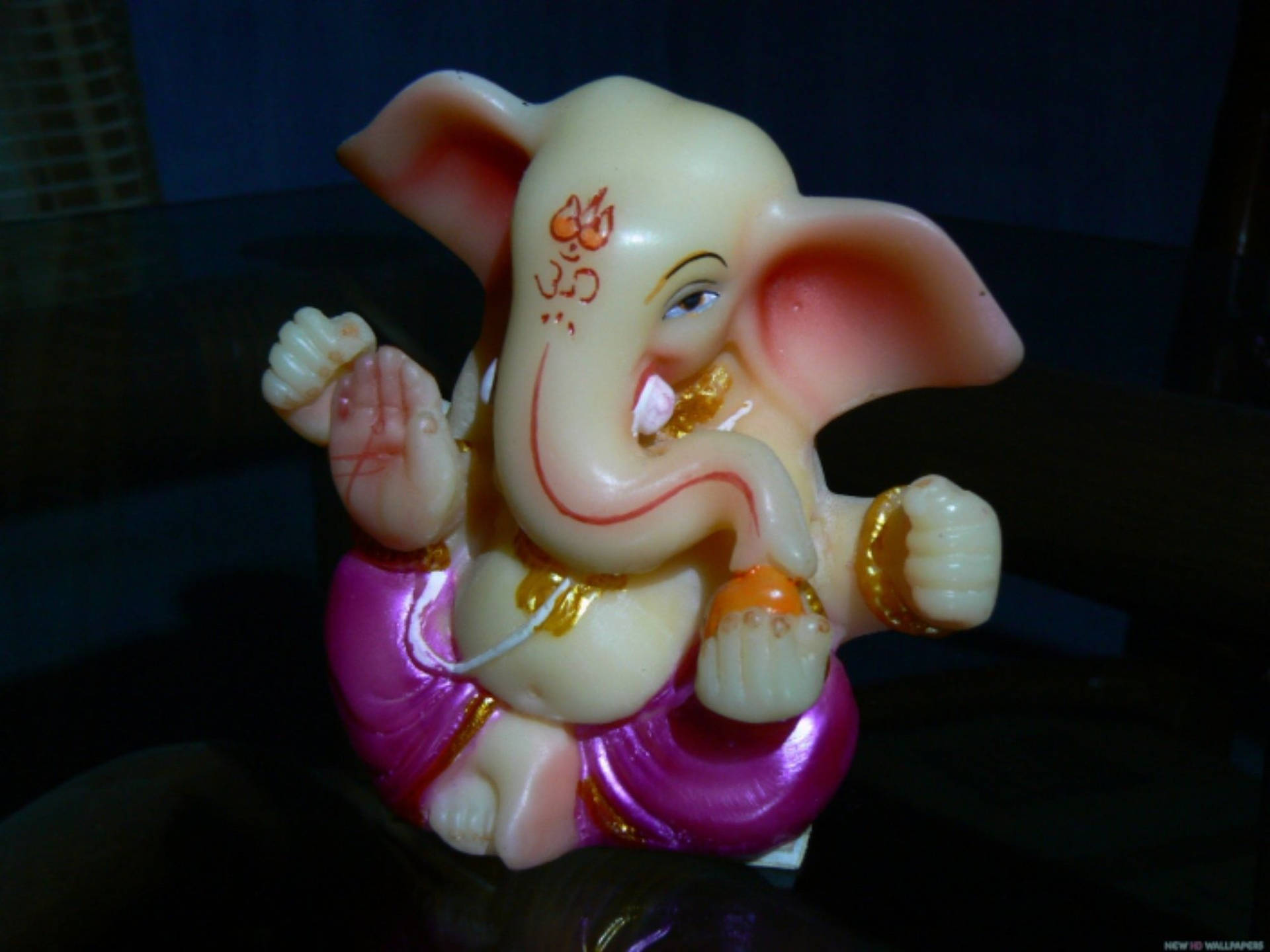 Bal Ganesh Shiny Figurine Background