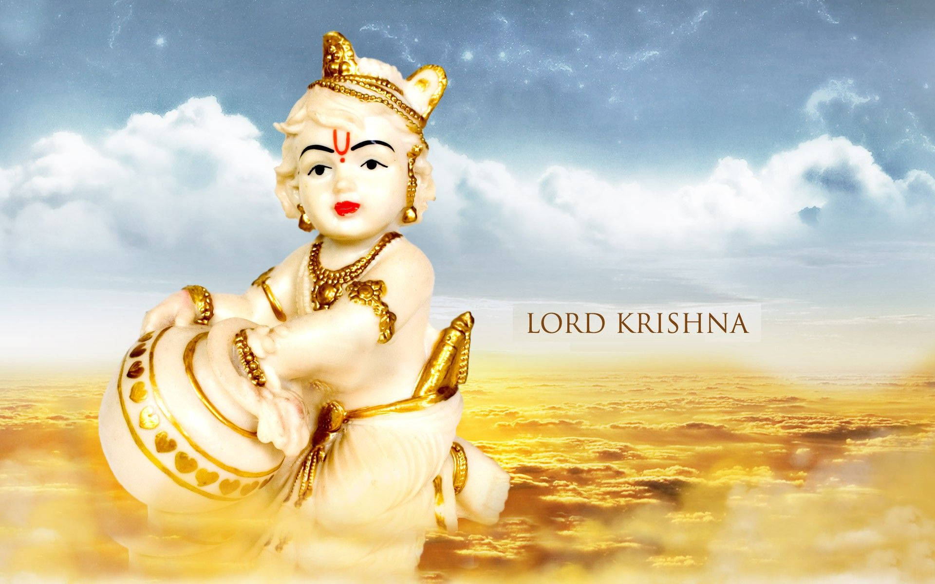 Bal Krishna Figurine Over Gold Clouds Background