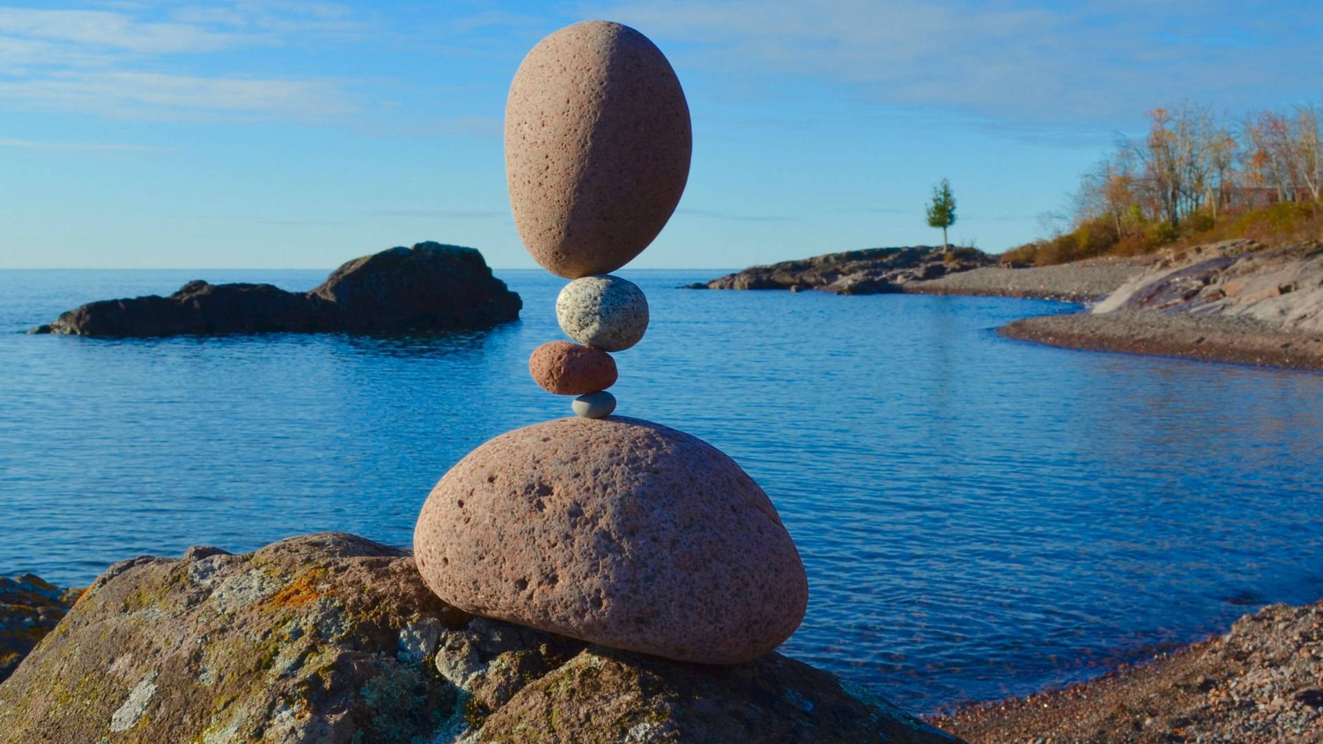 Balanced Stone Art At Lake Superior Background