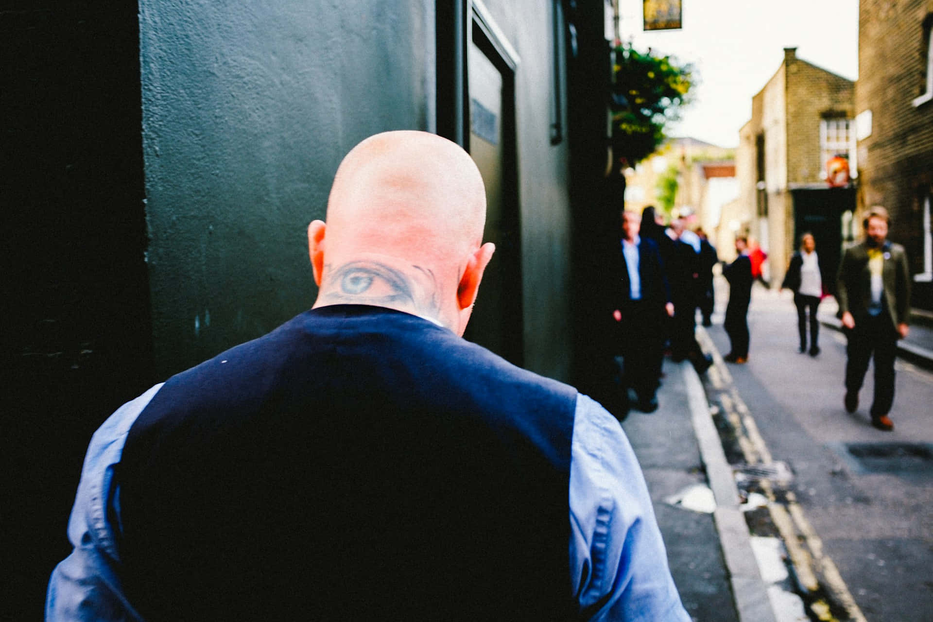 Bald Man Tattooed Head Urban Street Background