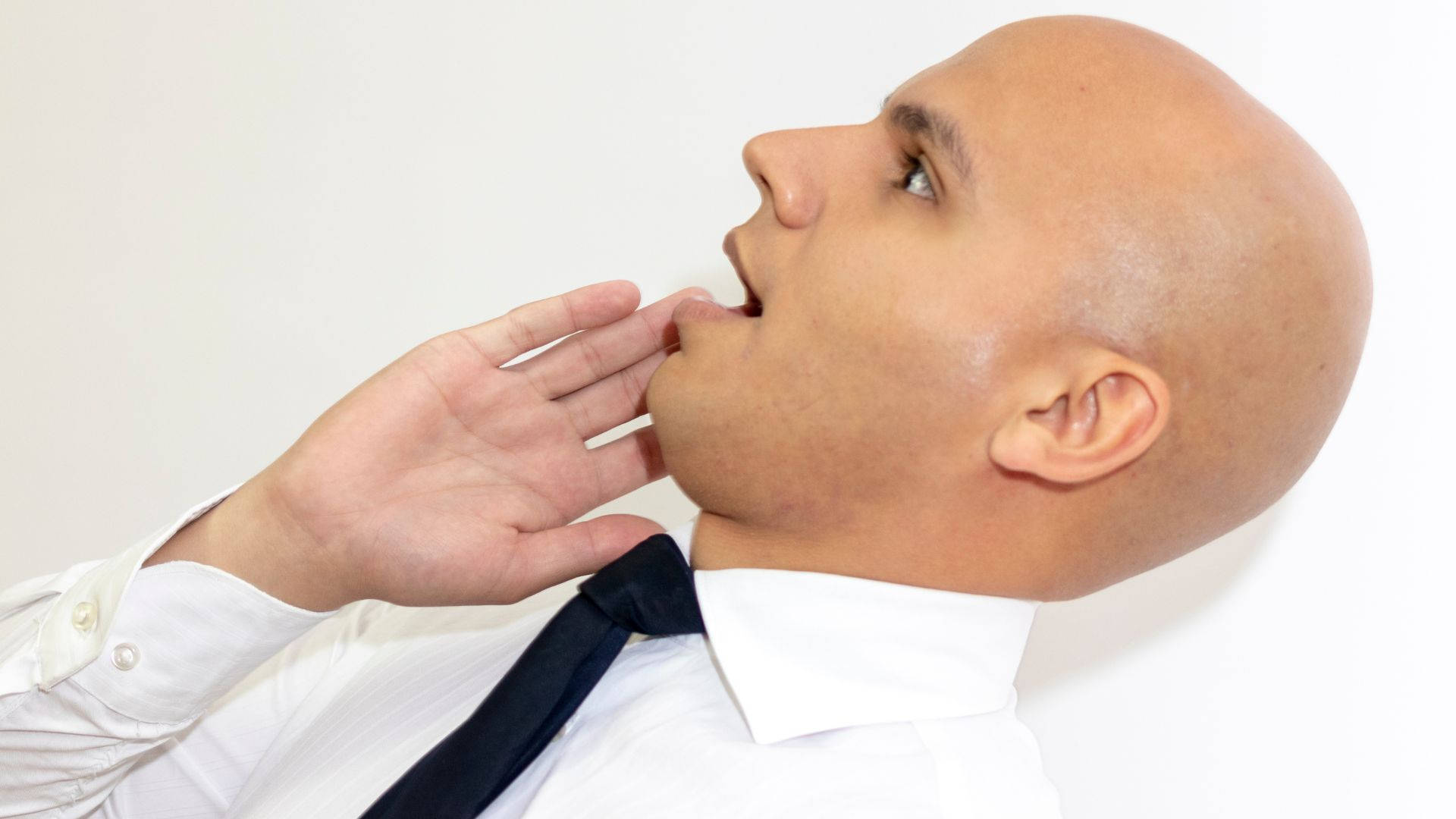 Bald Man Wearing A Black Necktie Background