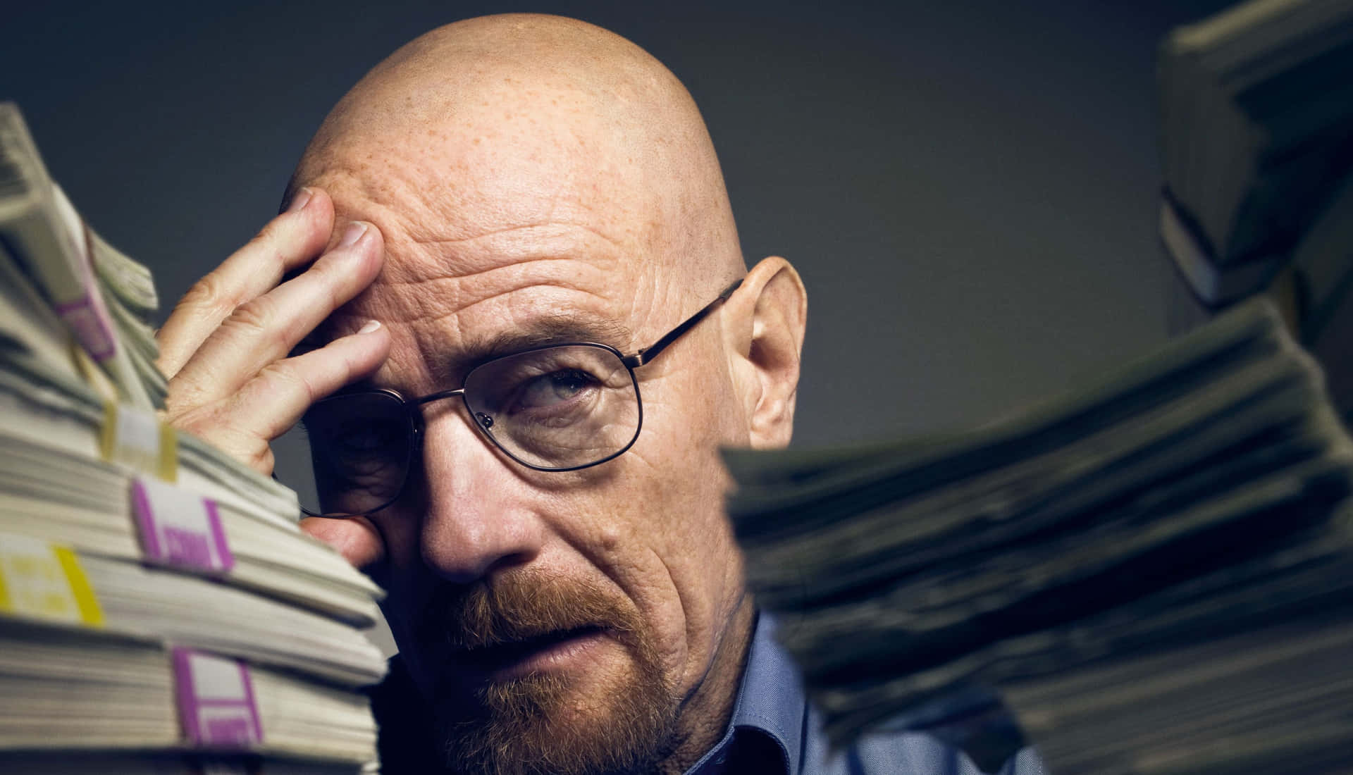 Bald Man With Glassesand Money Stacks Background