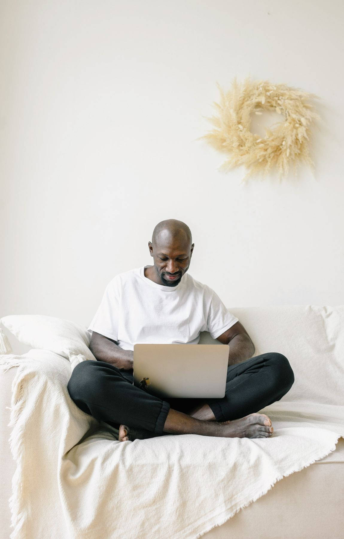 Bald Man Working On A Laptop Background