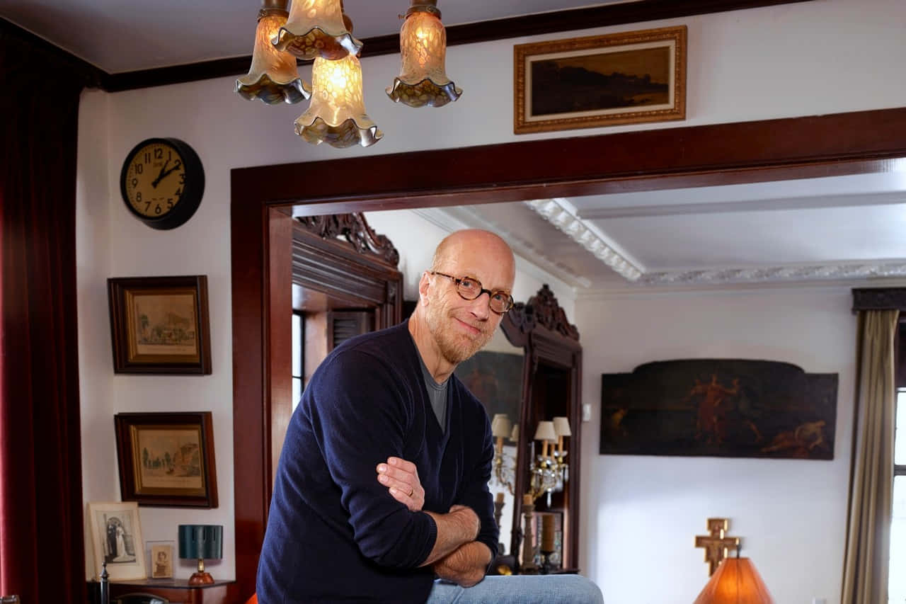 Bald Manin Traditional Room Leaningon Doorframe Background