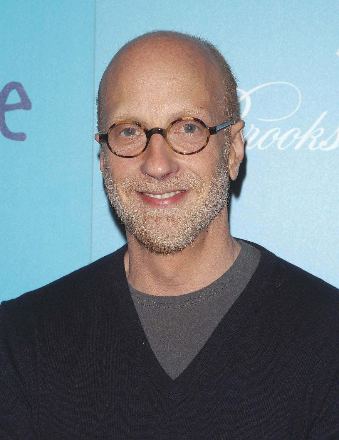 Bald Manwith Glassesat Event Background