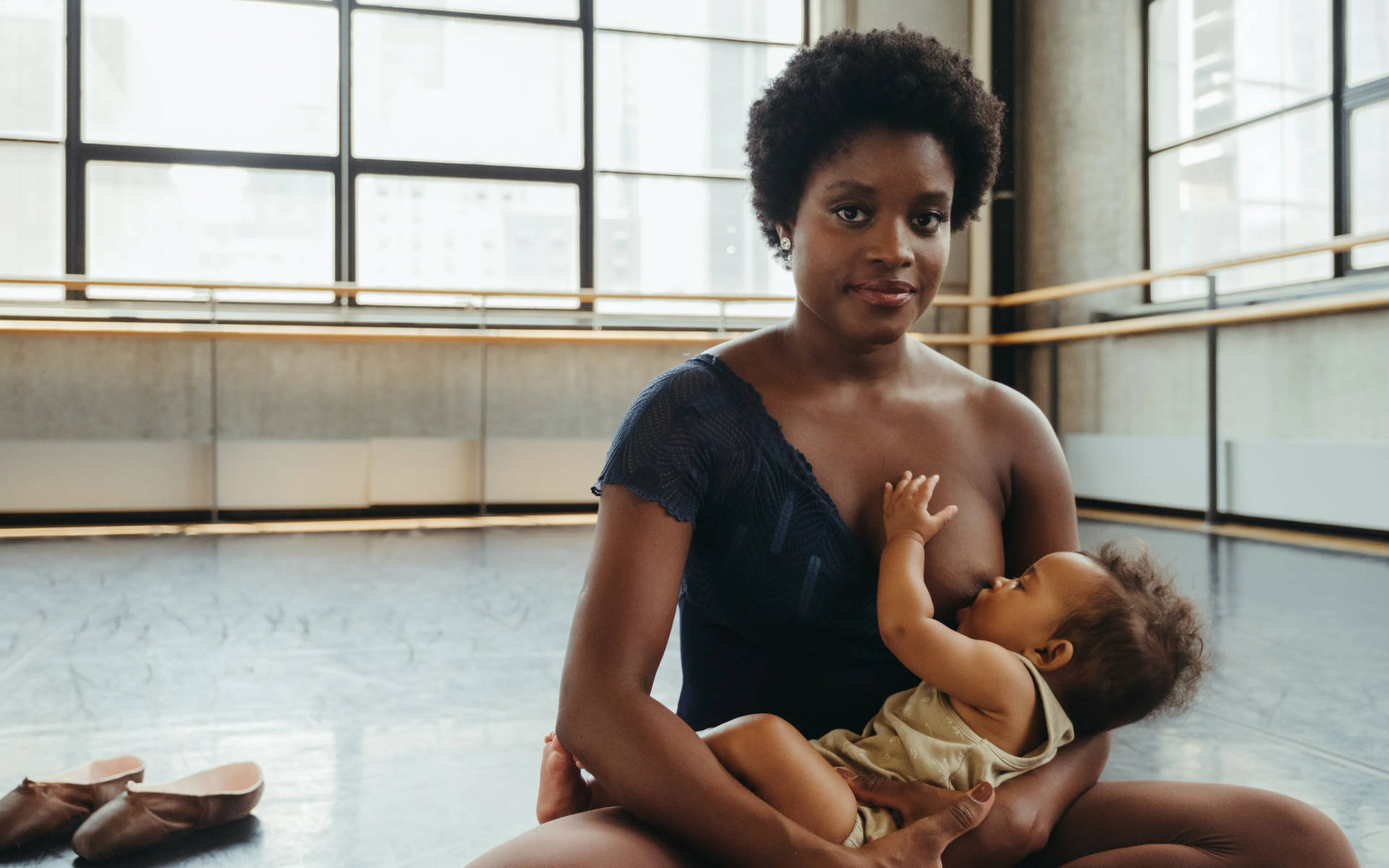 Ballerina Mother Feeding And Cradling Daughter Background