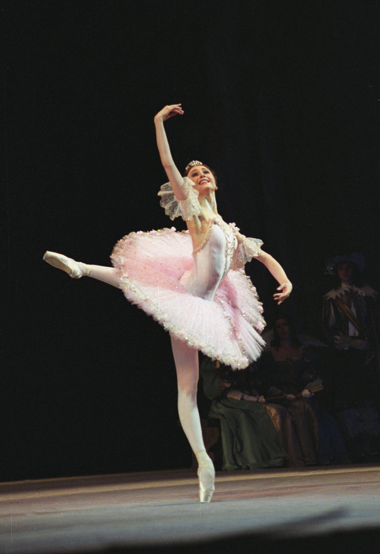 Ballet Dancer Performing On Stage Background