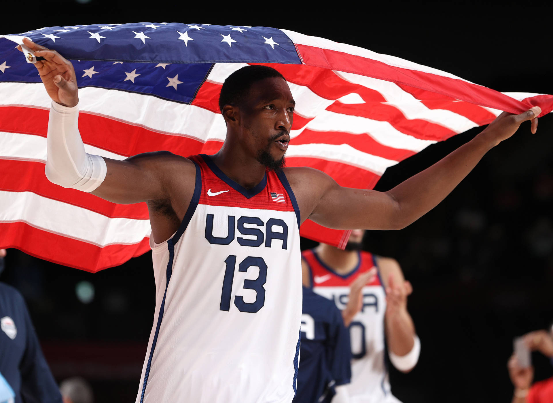 Bam Adebayo Raising American Flag Background