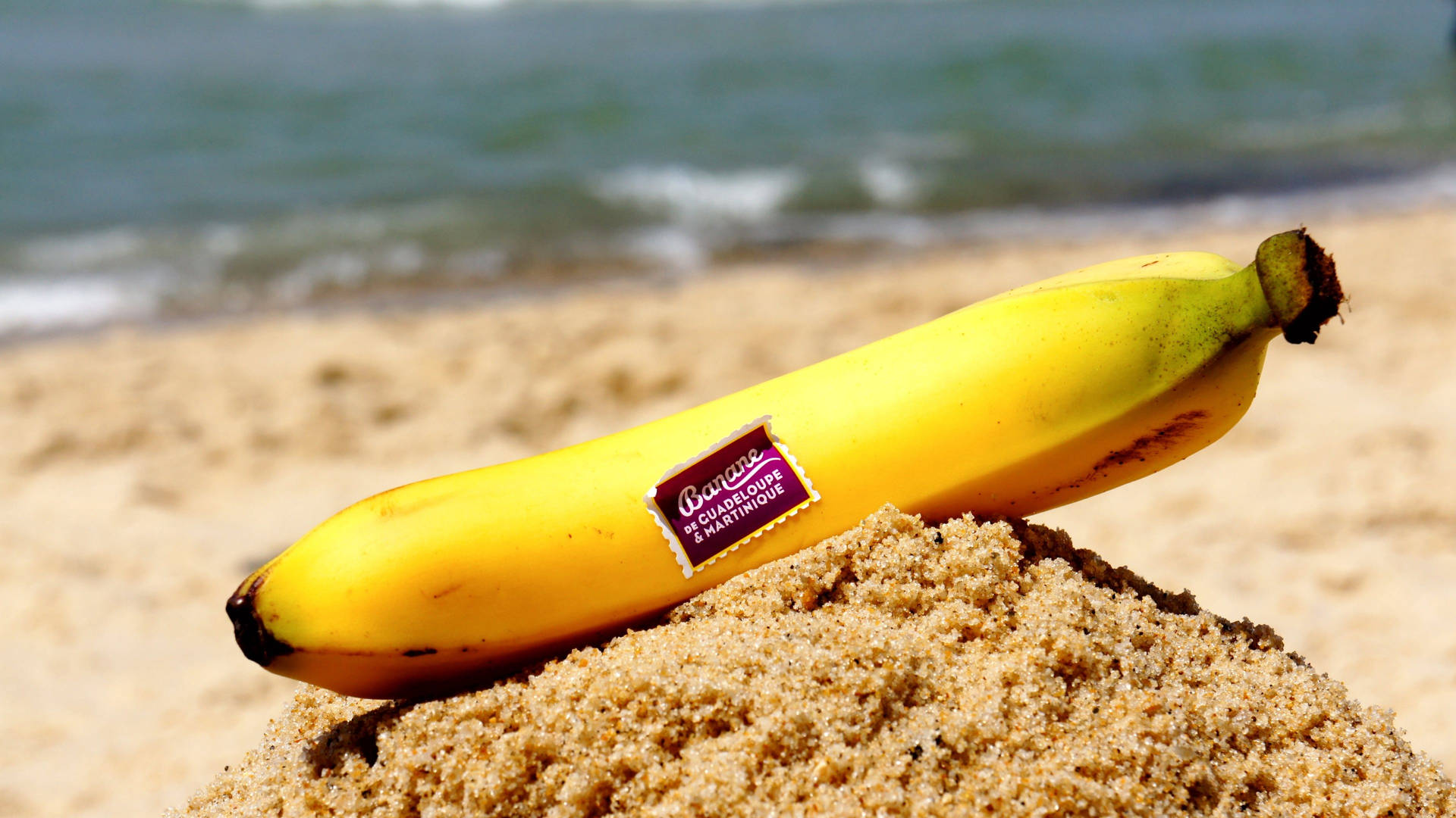 Banana On Sand Background