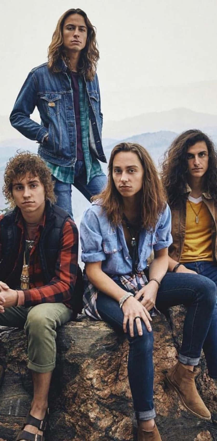 Bandmates Of Greta Van Fleet Posing For A Still Shot Background