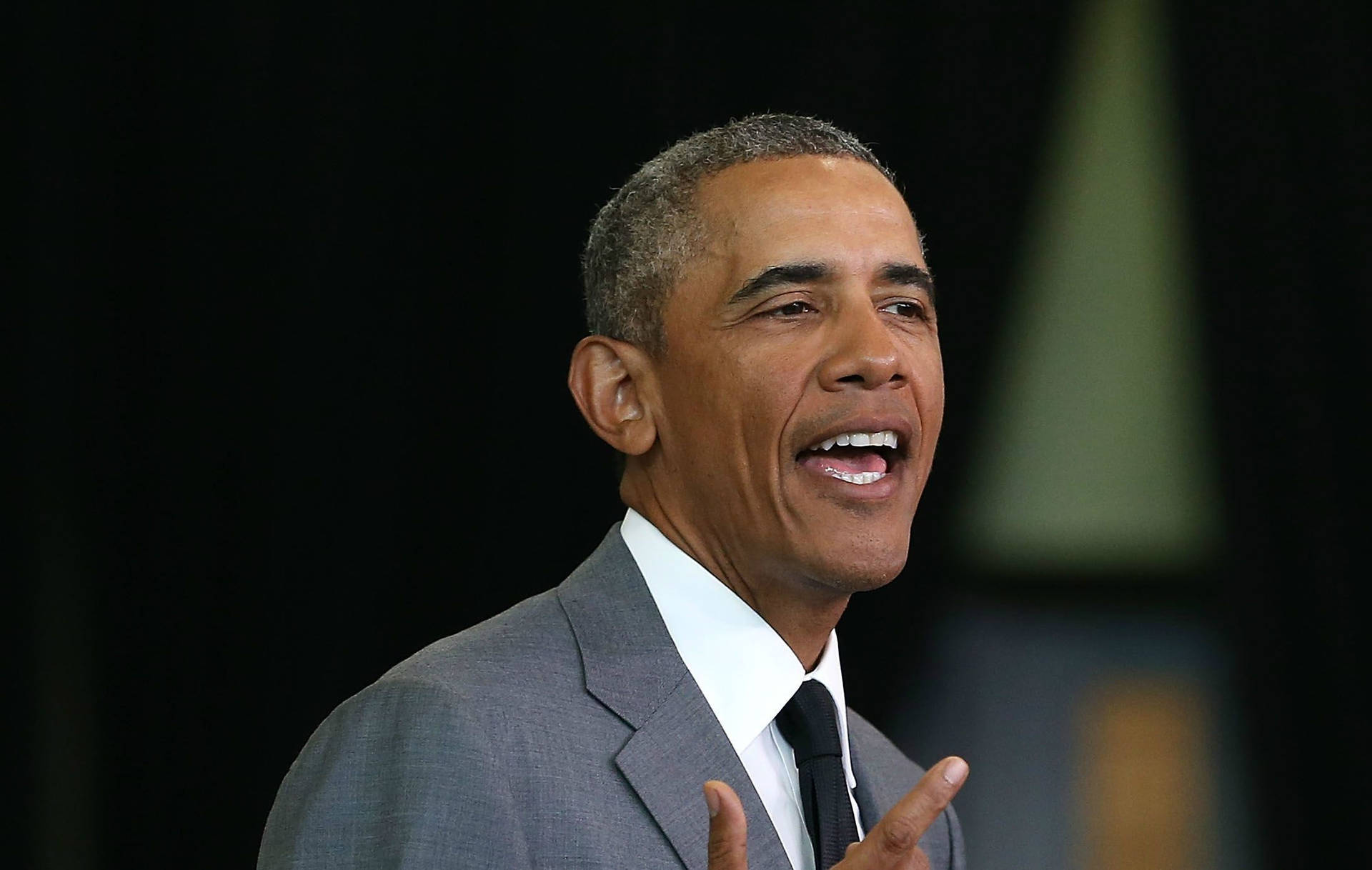 Barack Obama In Light Grey Suit Background