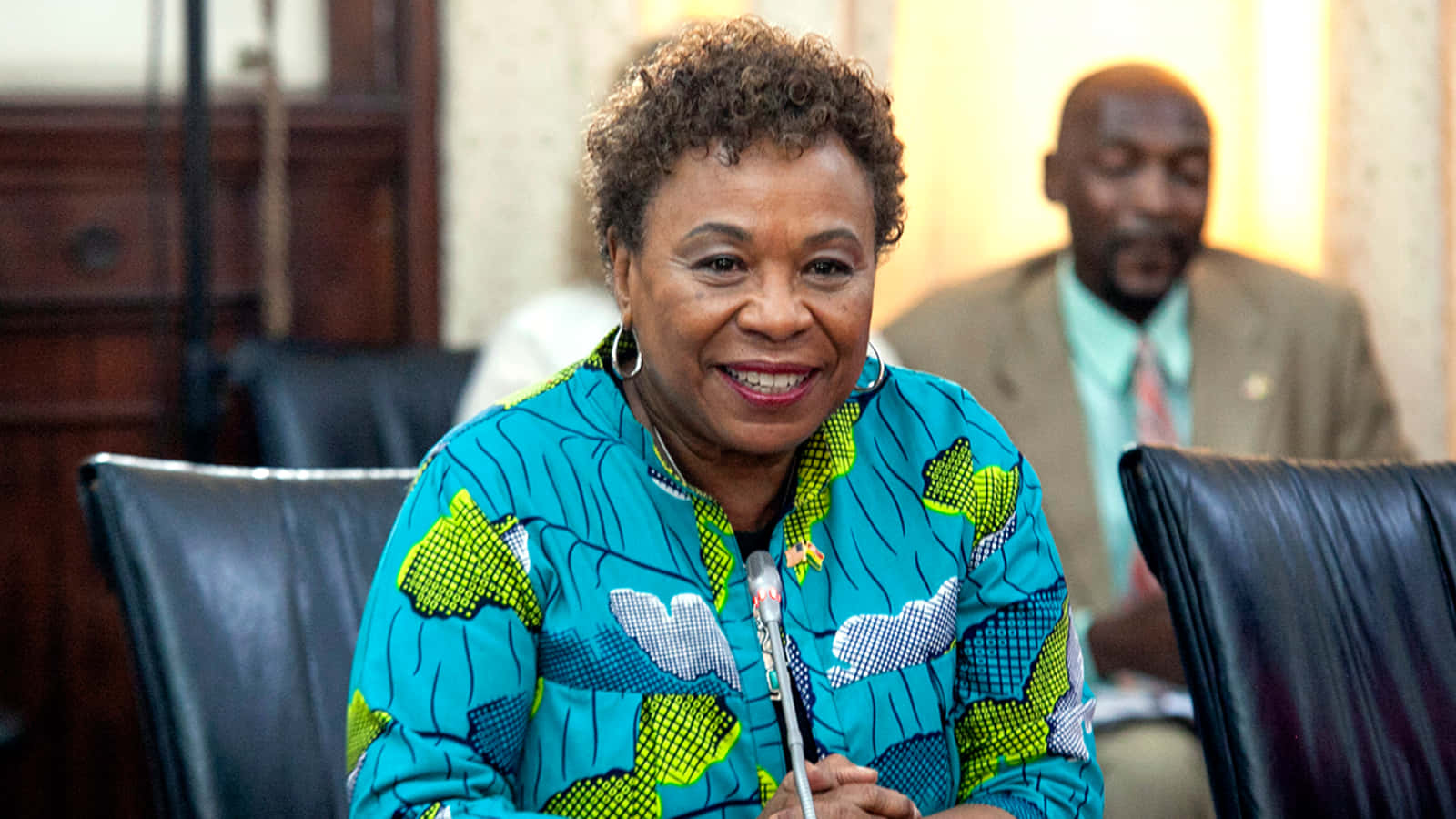 Barbara Lee Sitting While Smiling Background