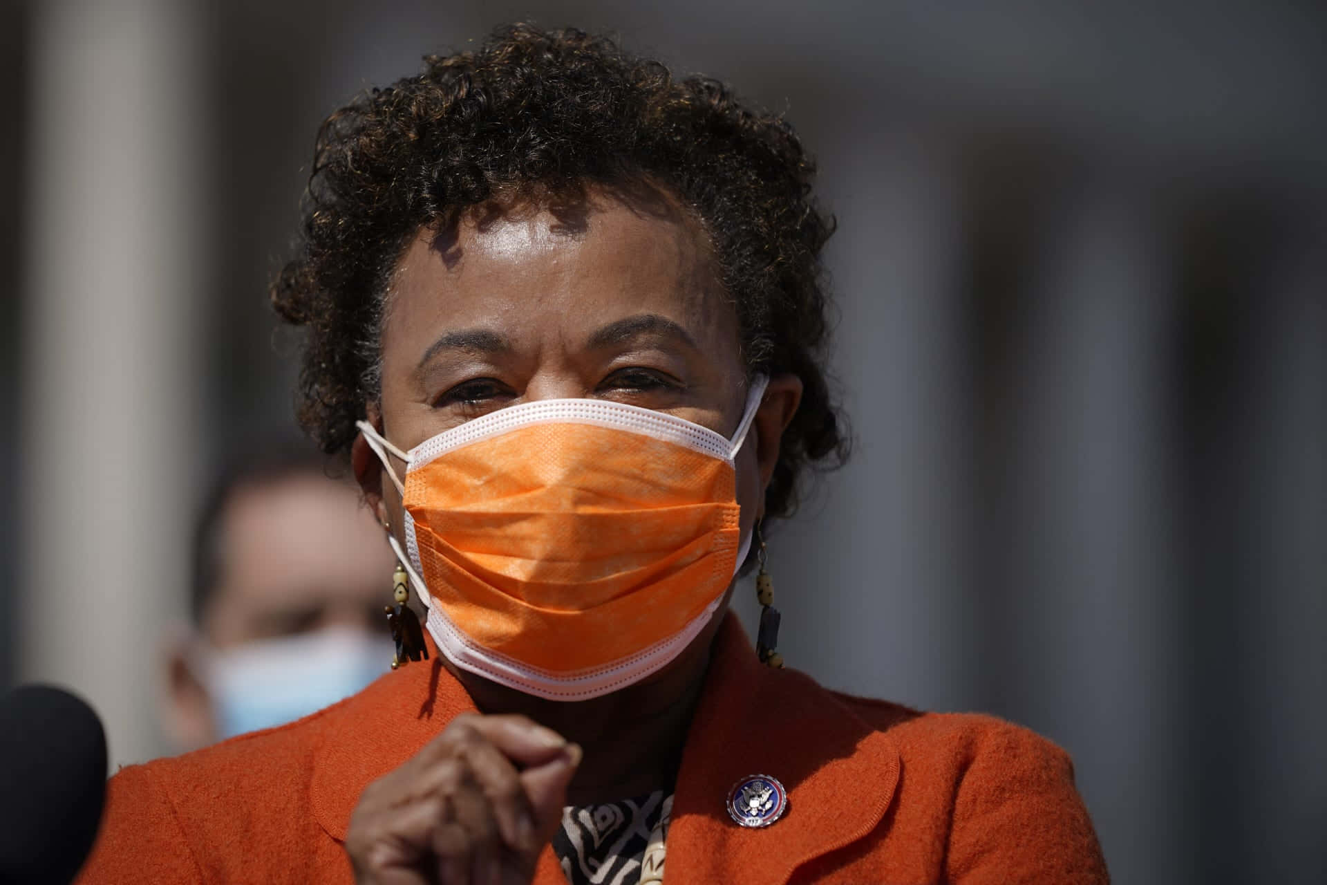 Barbara Lee Wearing Orange Mask Background