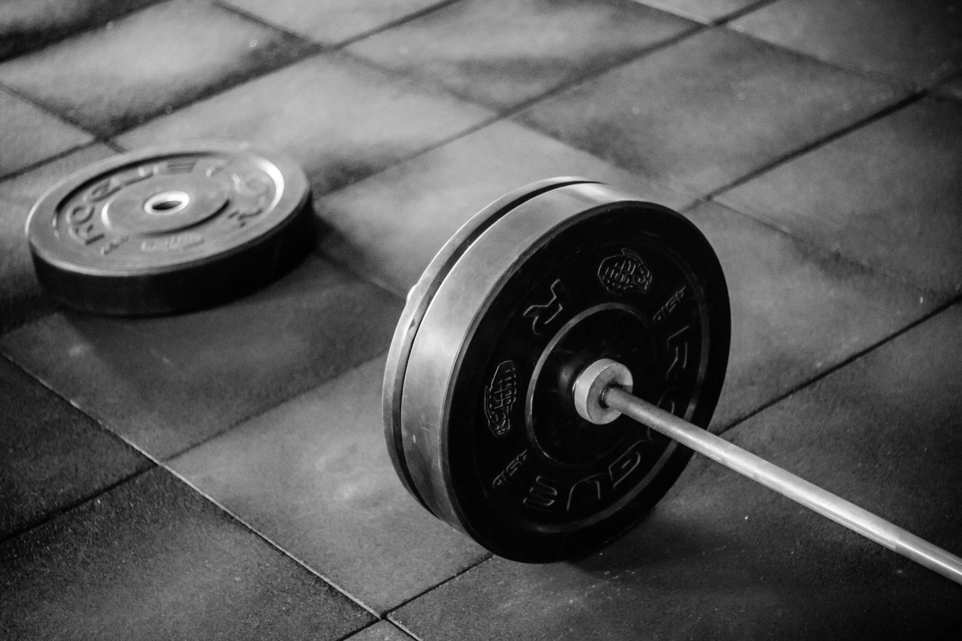 Barbell On Gym Floor Background
