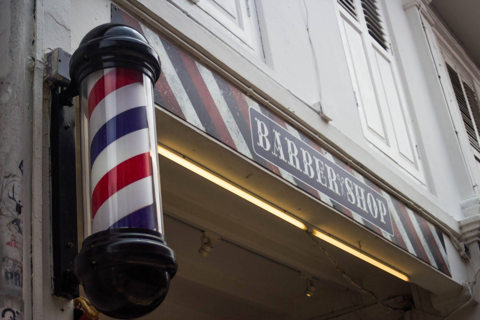 Barber Pole Beside Shop