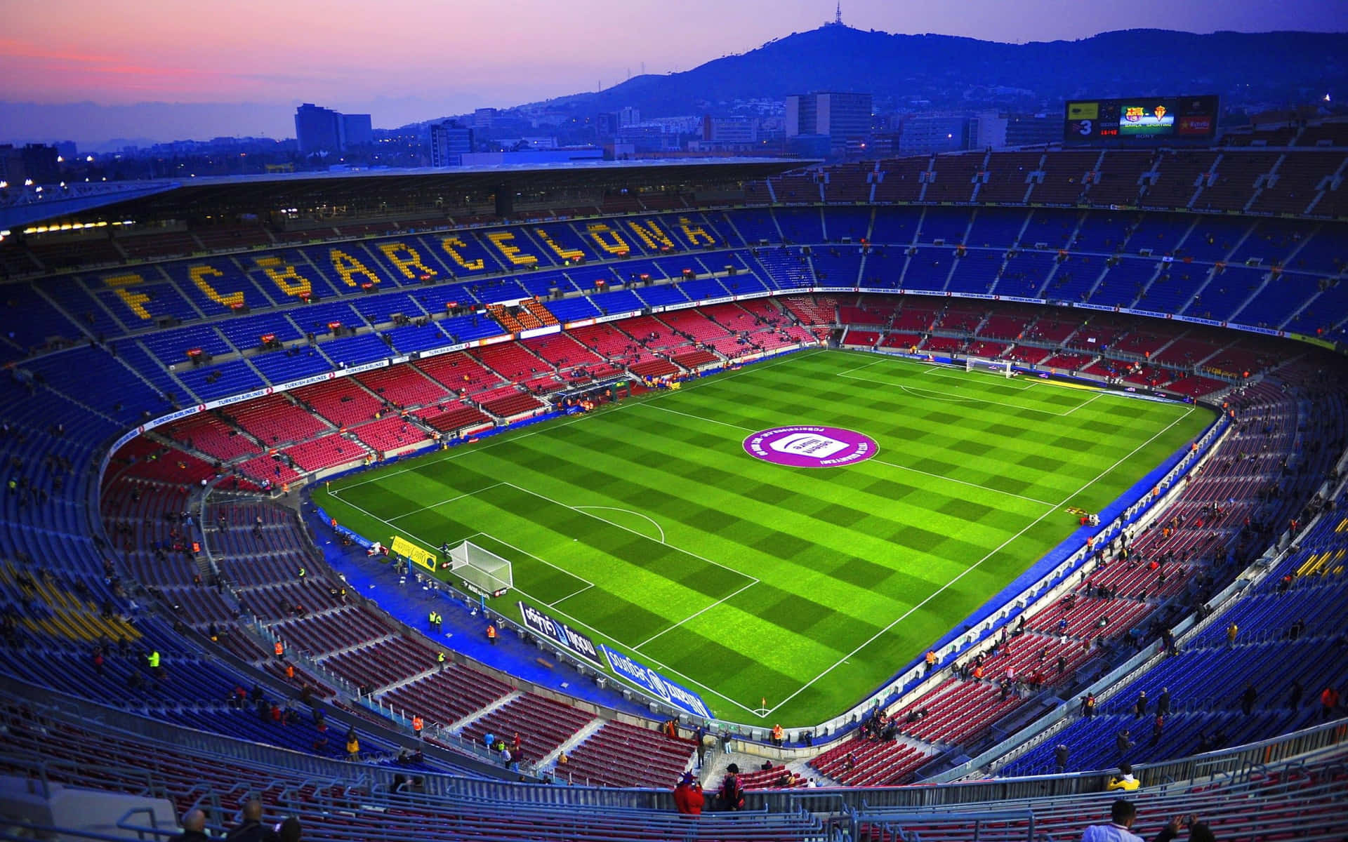 Barcelona Fc Stadium At Dusk Background