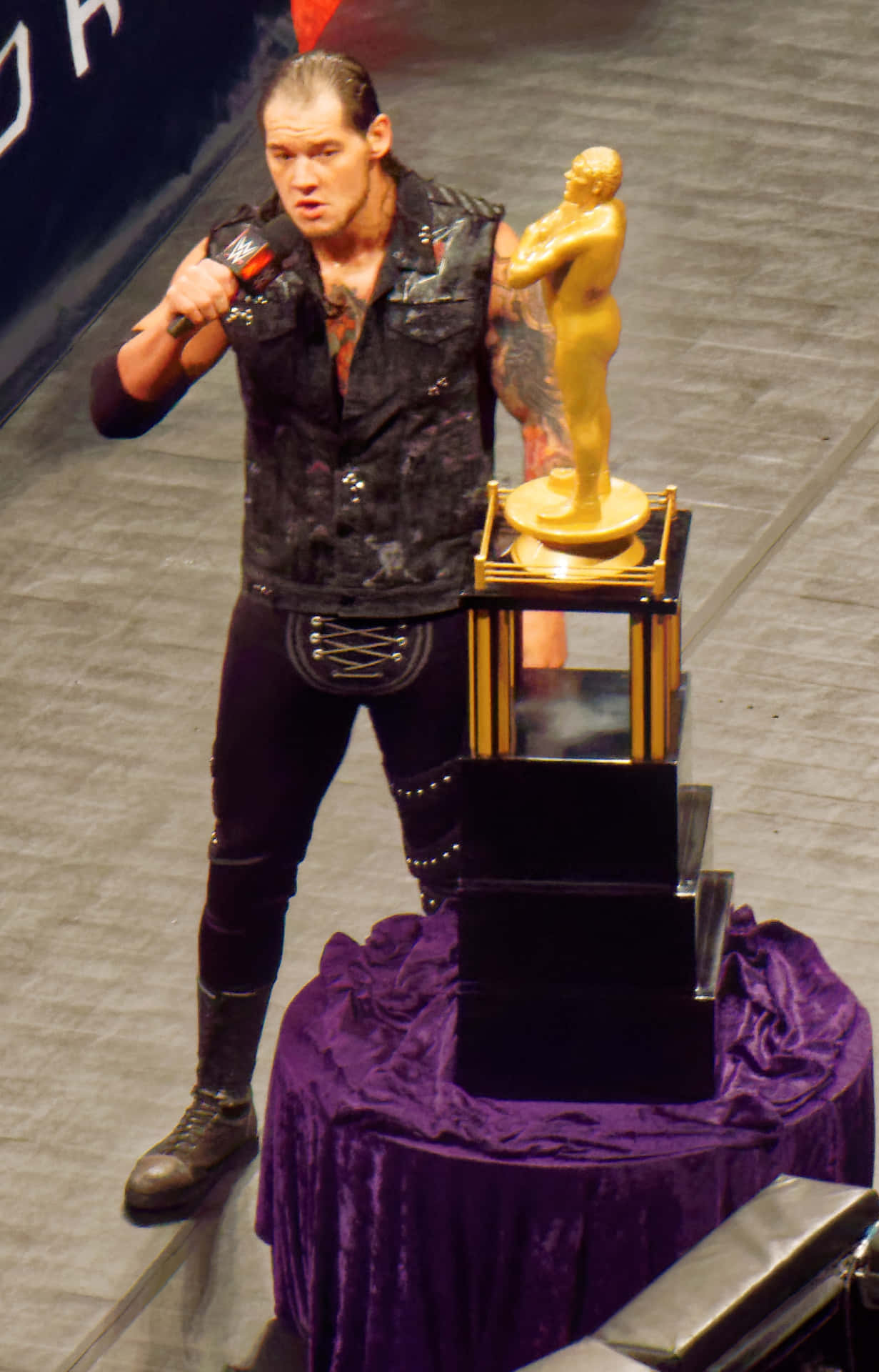 Baron Corbin Beside Andre The Giant Trophy