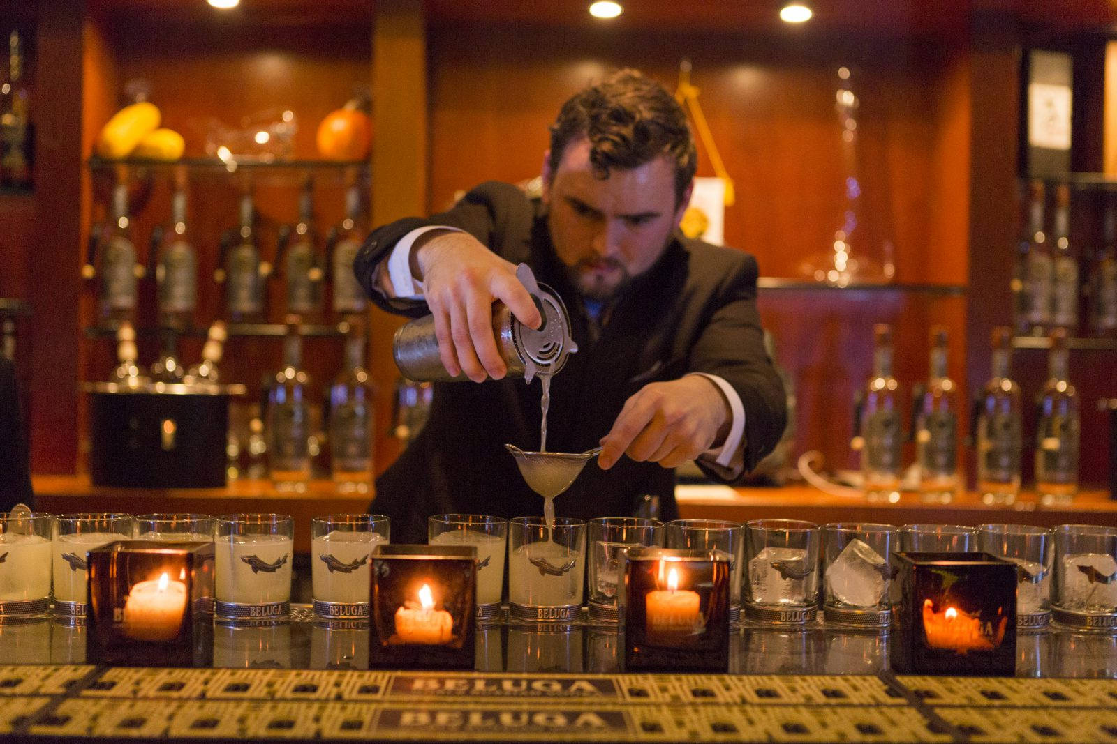 Bartender Mixing Beluga Vodka Drinks In Bar