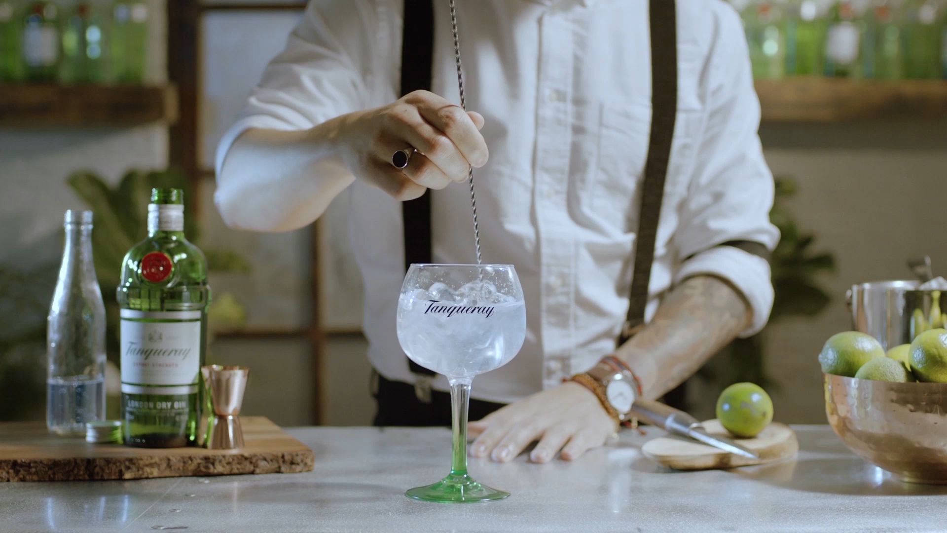 Bartender Mixing Tanqueray Gin With Tonic