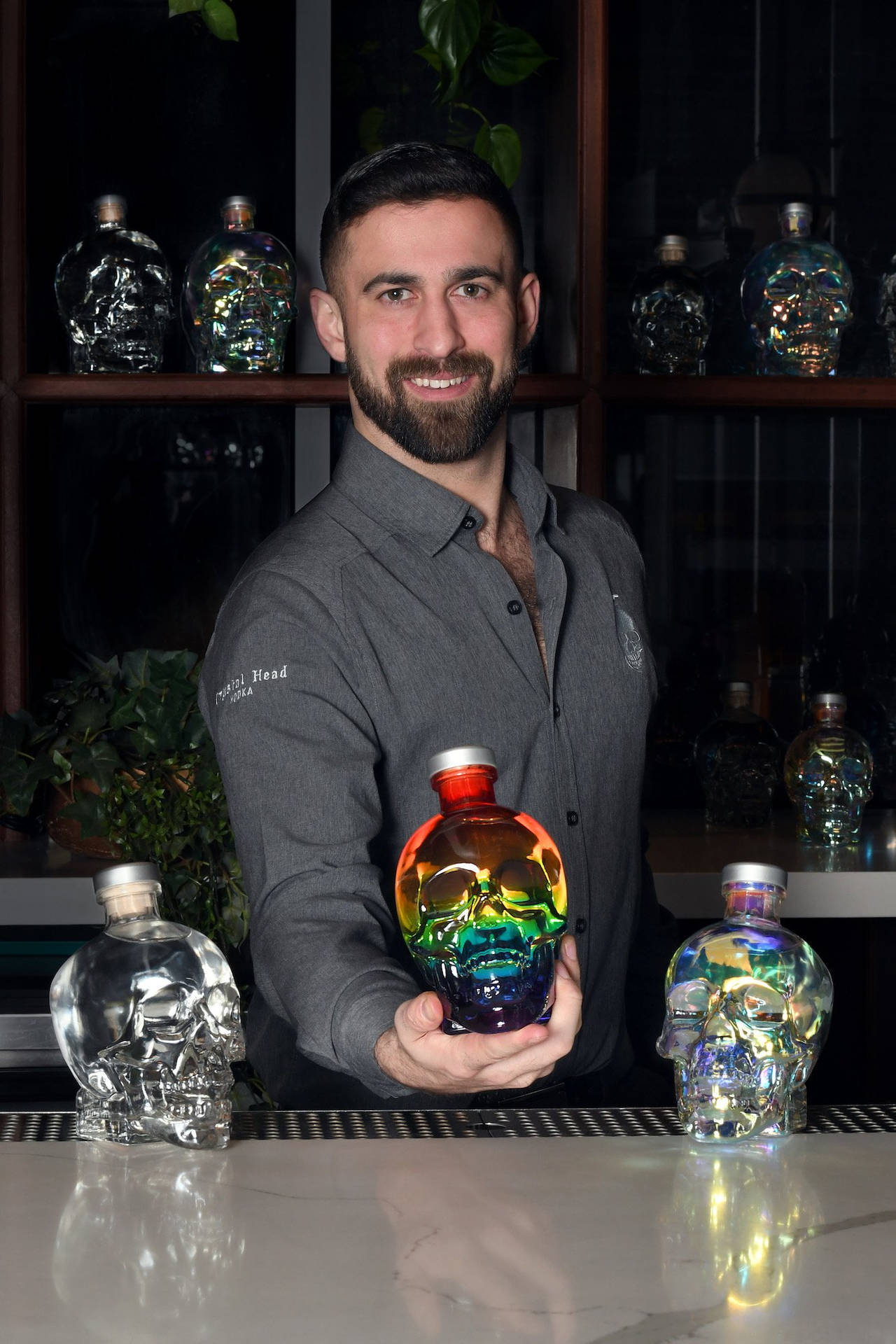 Bartender Mixing With Crystal Head Vodka Background