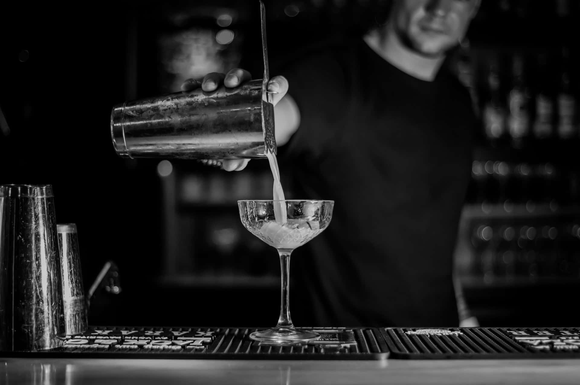 Bartender Pouring Cocktail Blackand White Background